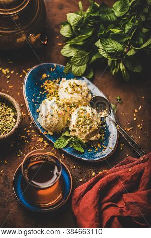 Turkish Dessert Semolina Helva With Pistachio And Mint Leaves
