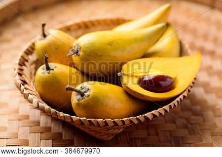 Eggfruit Or Canistel In A Basket, Thai Fruit, In Thai Names Such As Xiantao, Lamut Khamen Or Mon Kha