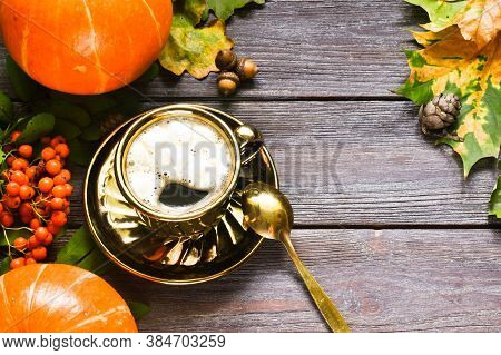Pumpkin Spiced Latte Or Coffee In Glass Decorated Knitted Scarf On Vintage Background. Autumn, Fall 