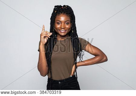 I Have An Idea. Attractive Afrcian American Woman Keeping Finger Pointed Upwards, Showing Something