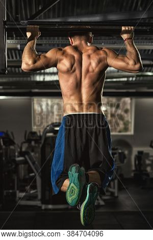 Get Fit Now. Rearview Vertical Full Length Shot Of An Athletic Shirtless Man With Strong Toned Body 