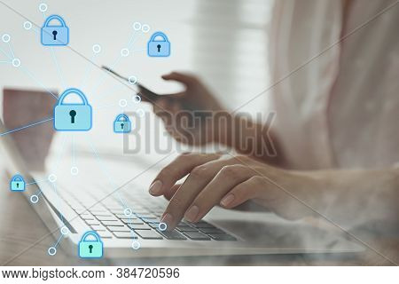 Information Security. Young Woman Using Laptop At Table Indoors, Closeup