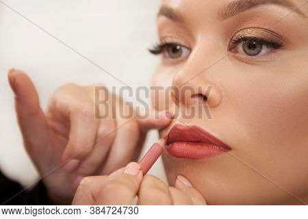 Makeup Artist Contouring Lips Of A Woman