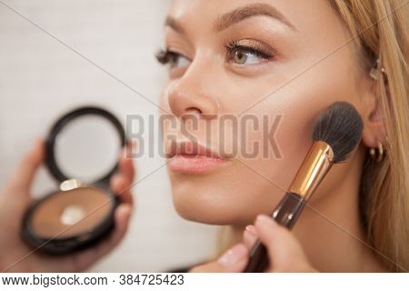Close Up Of A Beautiful Woman Getting Glammed By Professional Makeup Artist