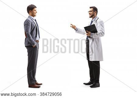 Full length profile shot of a professional young man and a doctor having a coversation isolated on white background