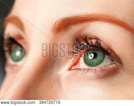 Female Blue Eyes Tinted In Green Colour With Special Contact Lens Close-up