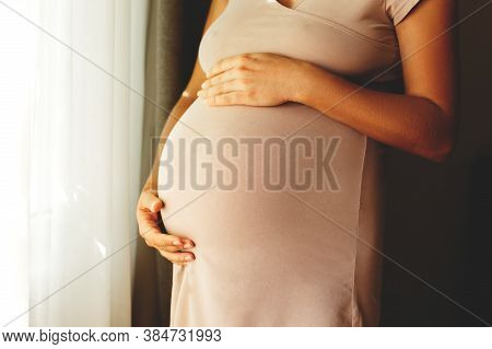 Cropped Shot Of Young Beautiful Woman On Third Trimester Of Pregnancy. Close Up Of Pregnant Female W