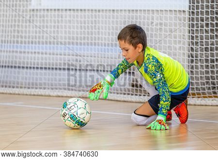 Odessa, Ukraine-circa-2020: Children Play Mini-football. Futsal Goalkeeper Stands At Gate. Sports Tr