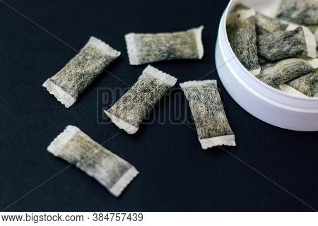 Round Box With Snus. Cigarette Substitute, Nicotine Pouches.