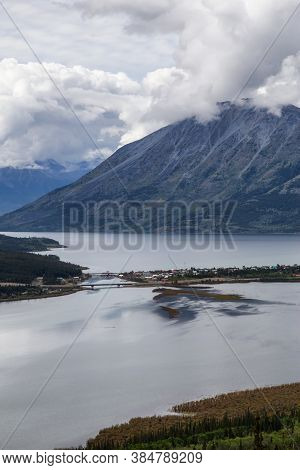 Beautiful View Of A Small Touristic Town, Carcross, Surounded By Canadian Mountain Landscape. Locate