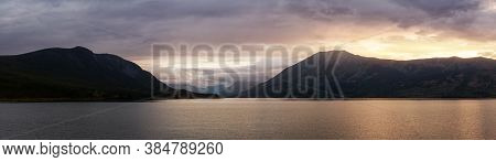 Panoramic View Of Nares Lake With Mountains In The Background During A Dramatic Colorful Sunrise. Ta