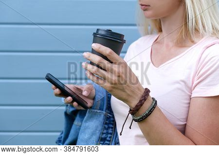Hippie Woman Wearing Boho Leather Bracelets On A Wrist Holding A Takeaway Paper Cup Of Coffee And A 