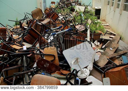 Salvador, Bahia / Brazil - October 7, 2012: Broken School Furniture Is Seen Huddled In The Courtyard