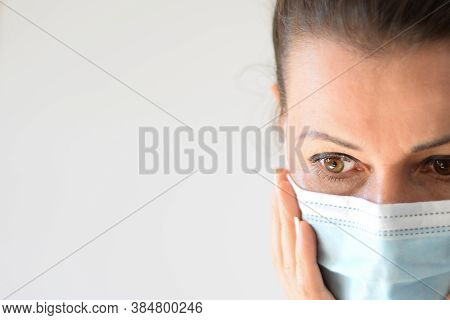Can\'t Breath, Hard To Breath. Girl Holds Hands On A Surgical, Antimicrobial Face Mask, Sad Big Eyes