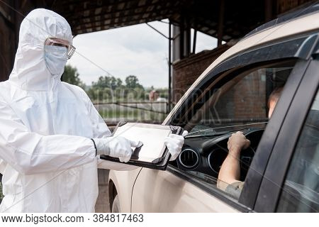 Checking And Disinfecting Car For Virus Covid-19 And Bubonic Plague Border Of City And Country. Doct