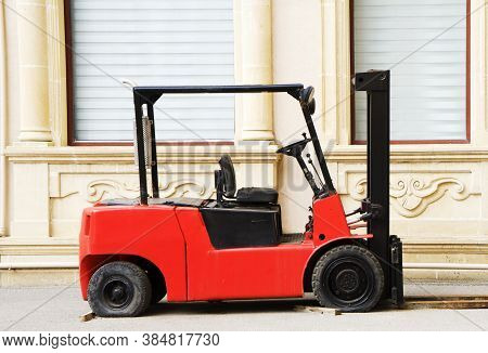 Red Rough Terrain Forklift In The Yard.