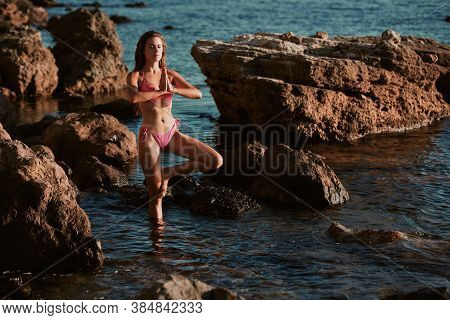 Yoga Time. Self-absorbed And Meditation Concept. Young Woman In Bikini Training On Fresh Air. Virgin