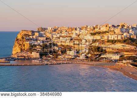 Peschici, Gargano, Puglia, Italy, July 2020: Aerial View Of Peschici At Sunset, Small Picturesque Vi