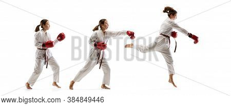 High Jump. Junior In Kimono Practicing Taekwondo Combat, Martial Arts. Young Female Fighter With Red