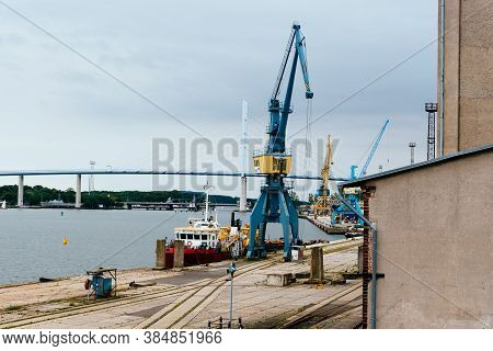 Stralsund, Germany - July 31, 2019: View Of The Commercial Harbour With Cranes. Stralsund Old Town I