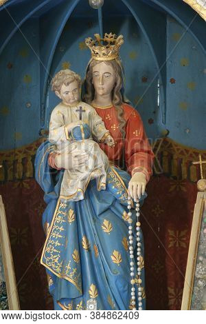 RADOBOJ, CROATIA - SEPTEMBER 21, 2014: Our Lady of the Snows, altar in the parish church of the Holy Trinity, Radoboj, Croatia