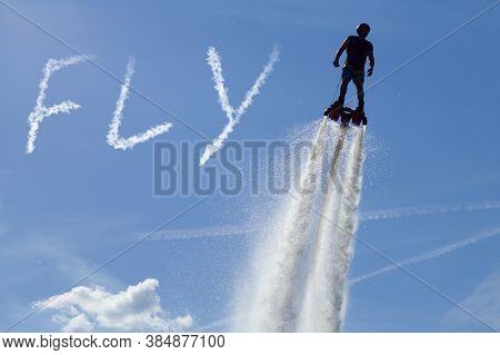 Flyboard - Man Exibition. Flyboarding Session In The Aquamarine Waters. Inscription \