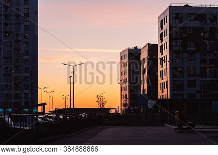 Apartment Buildings At Sunset. Residential District Cityscape In Evening.