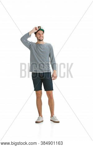 Smiling Confident. Caucasian Male Sailor In Uniform On White Studio Background. Young Man Using Mode