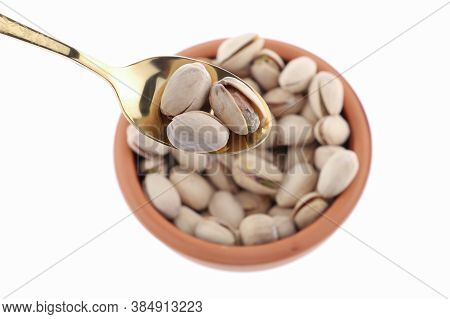 Pistachios In White Porcelain Bowls. Roasted Pistachio Seeds In Shells And Shelled. Green, Dried Fru
