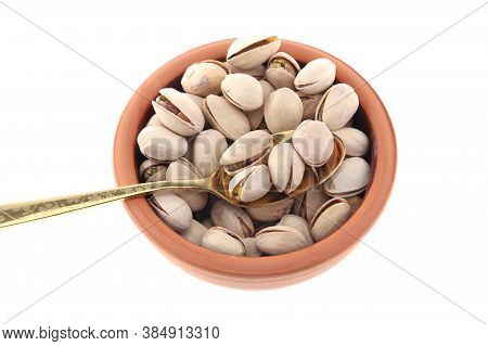 Pistachios In White Porcelain Bowls. Roasted Pistachio Seeds In Shells And Shelled. Green, Dried Fru