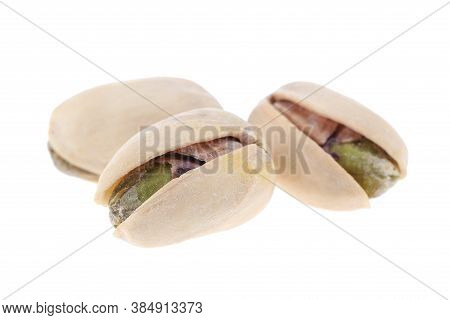 Pistachios In White Porcelain Bowls. Roasted Pistachio Seeds In Shells And Shelled. Green, Dried Fru