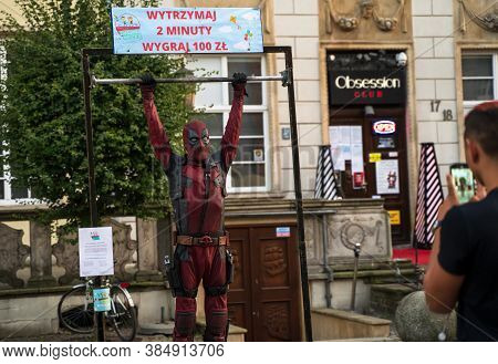 Gdansk, North Poland - August 15, 2020: A Man Wearing Deadpool Comic Character Constume Hanging On A