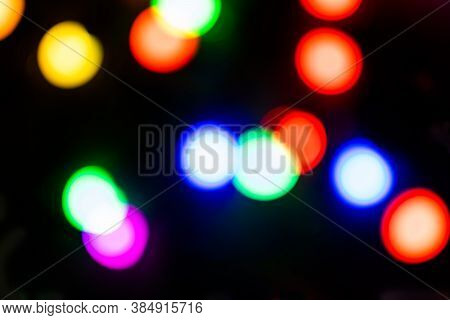 Christmas Color Garland At Night.color Festoon On Black Background