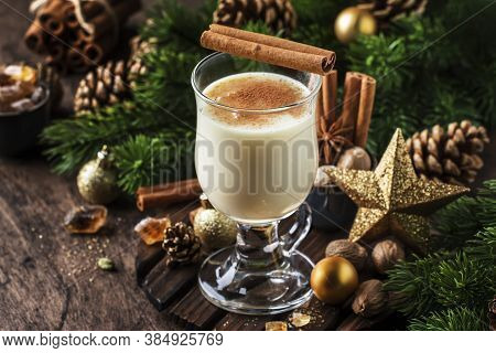 New Year Or Christmas Eggnog Cocktail - Hot Winter Or Autumn Drink With Milk, Eggs And Dark Rum, Spr