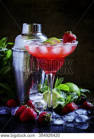 Alcoholic Cocktail With Strawberry, Lime And Ice, Black Background, Selective Focus