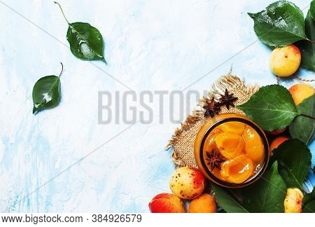 Apricot Jam With Anise Stars And Fresh Apricots With Leaves, Top View