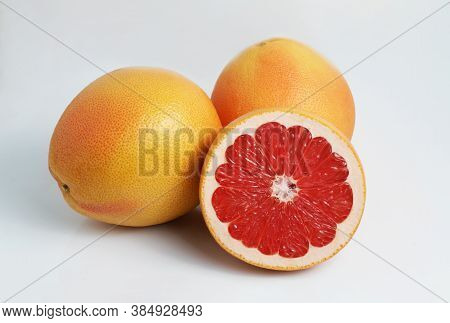 Fresh Red Grapefruits. Slice. Isolate On A White Background. Side View