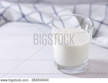 Homemade Fermented Milk Drink In A Glass Of Kefir On A Light Background. Place For Your Text.