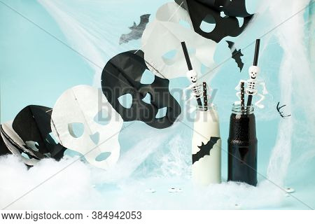 Cute Halloween Balck Whitel Drinks For A Kids Party In Spider Cobweb On Blue Background, Funny Food 