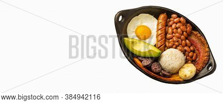 Bandeja Paisa, Typical Dish At The Antioqueña Region Of Colombia. It Consists Of Chicharrón (fried P