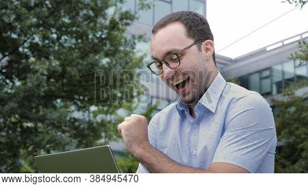 Comic Emotion. Man Surprised With Laptop Computer Looking At Scr