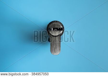 A Door Lock Cylinder Core On The Blue Background. The Cylinder Of The Lock. Installing A New Lock On
