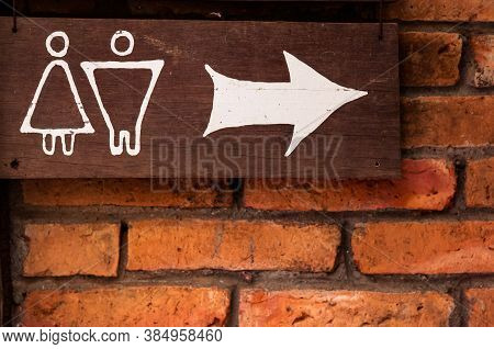 Navigation Sign, Signs Leading To The Bathroom Written In White Letters On Old Wood. Bangkok,thailan
