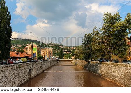 Sarajevo, Bosnia And Herzegovina - July 3rd 2018: The Miljacka River Flowing Through Sarajevo On A S
