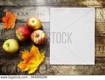 Home Background With Apples, White Frame And Wood Texture. Free Space For Your Design And Home Inter