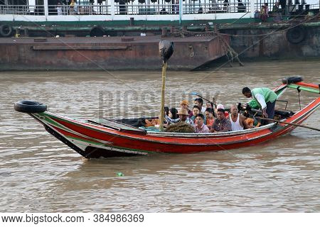 Yangon, Myanmar, Feb 24, 2019: Myanmar Traditional Ferry Driving With Passenger At Yangon River On T