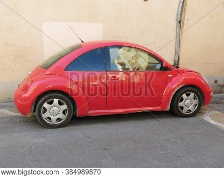 Narbonne, France - Circa August 2018: Red Volkswagen New Beetle Car