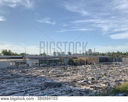 Remains Of A Destroyed Building. Wasteland With Debris Of Destroyed Premises. Construction Site For
