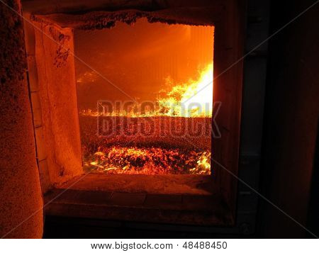 Fire The Combustion Of Biomass In The Form Of Pellets In The Boiler Stoker Coal, Visible Through The