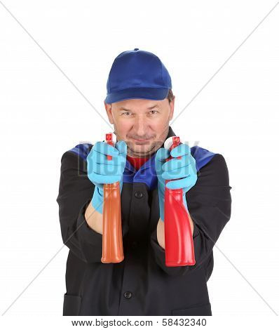 Man holds spray botlles as gun.
